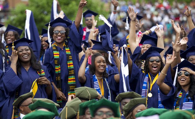 Students cheers as the class of 2014 celebrate during the graduation ceremony at Howard University in Washington, on Saturday, May 10, 2014. Rapper and music mogul Sean Combs delivered the commencement address at Howard University on Saturday. (AP Photo/Jose Luis Magana)