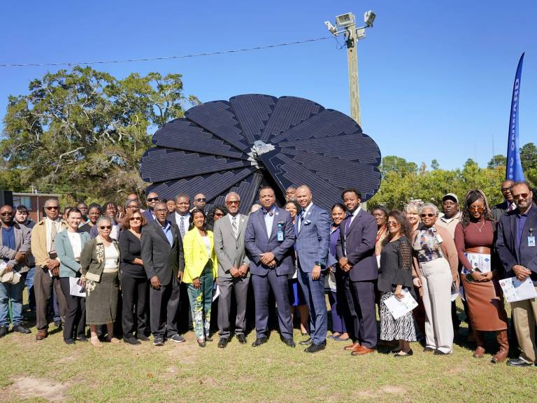 Attendees gather to celebrate the unveiling of the SmartFlower.