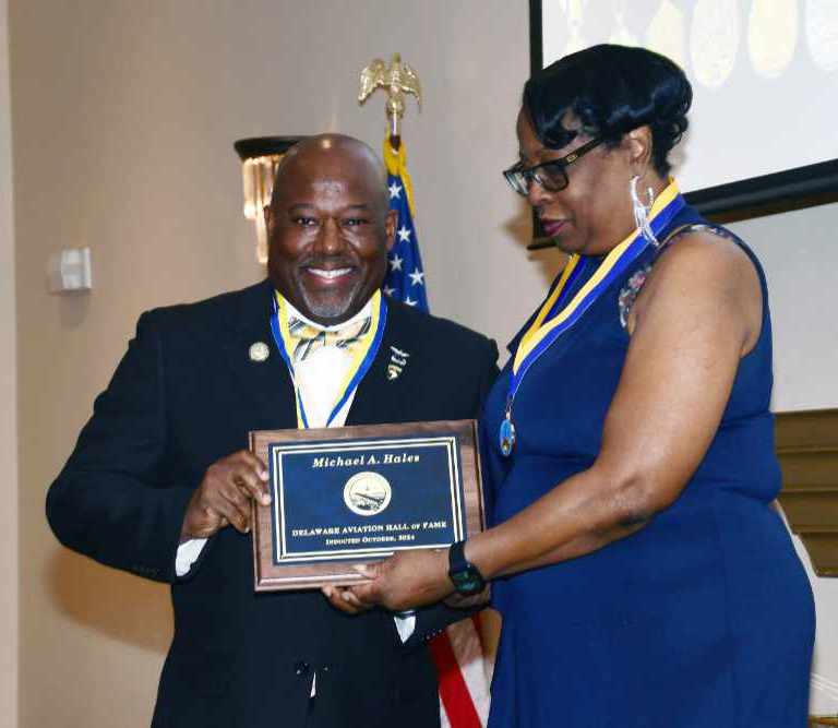 Lt. Col. Michael Hales receives his induction into the Delaware Aviation Hall of Fame from LeSans Alexander, Chair of that organization’s Board of Trustees. Lt. Col. Hales was recognized from his 25-year career as a U.S. Army aviator and for his seven years as the Director of the DSU Aviation Program.