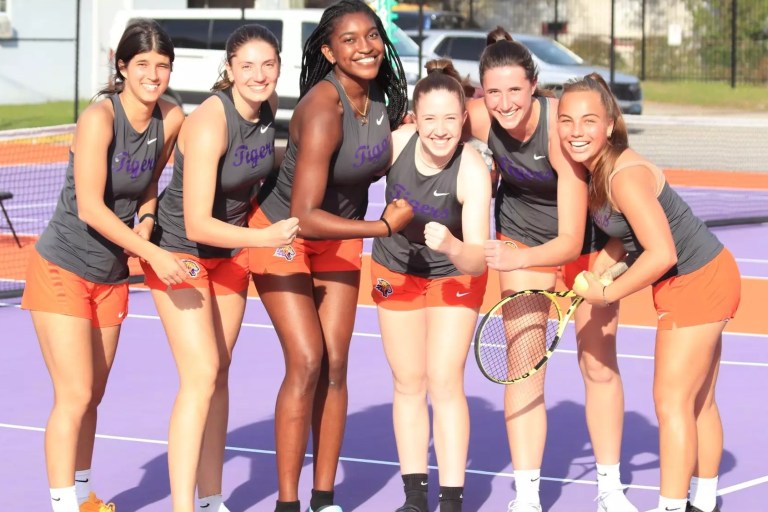 Edward Waters women's tennis players after a win.