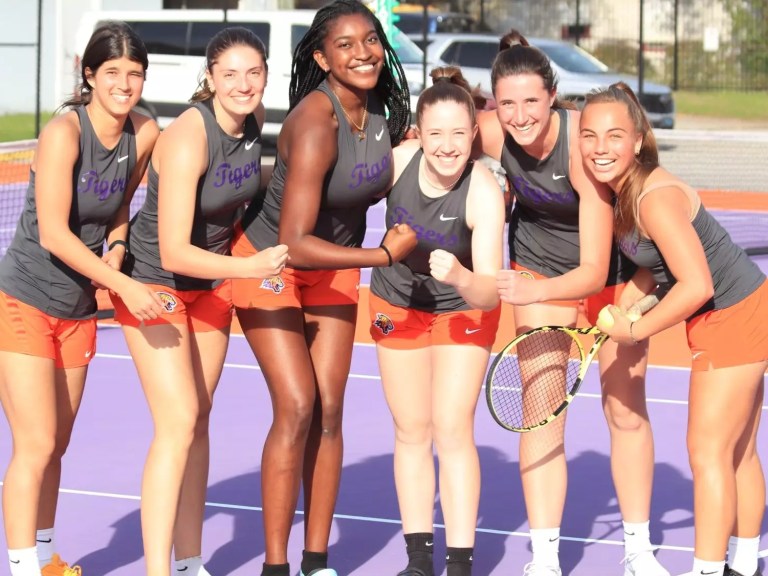 Edward Waters women's tennis players after a win.