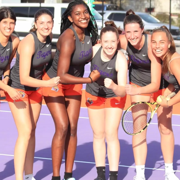 Edward Waters women's tennis players after a win.