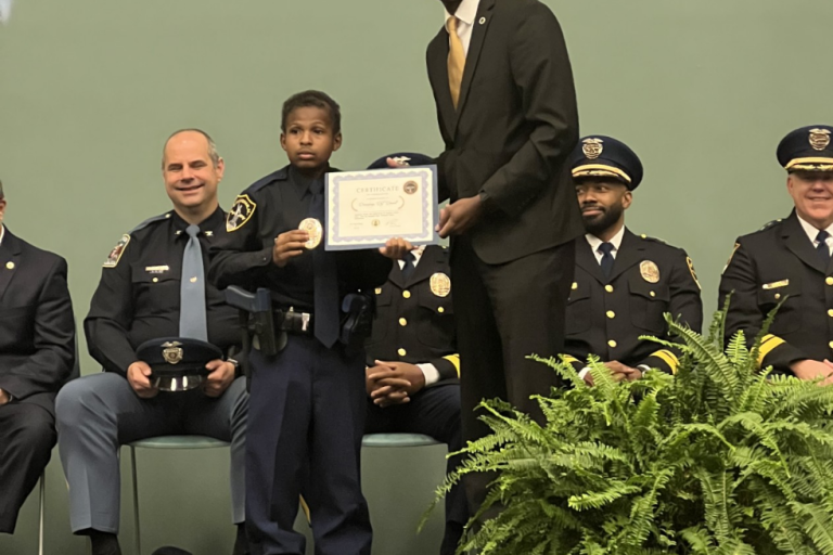 Devarjaye "DJ" Daniel receives honorary police officer title.