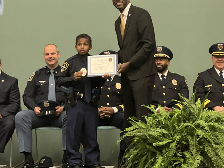 Devarjaye "DJ" Daniel receives honorary police officer title.