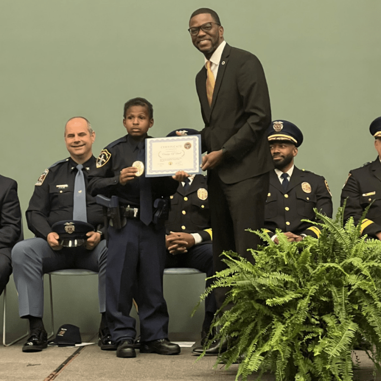 Devarjaye "DJ" Daniel receives honorary police officer title.