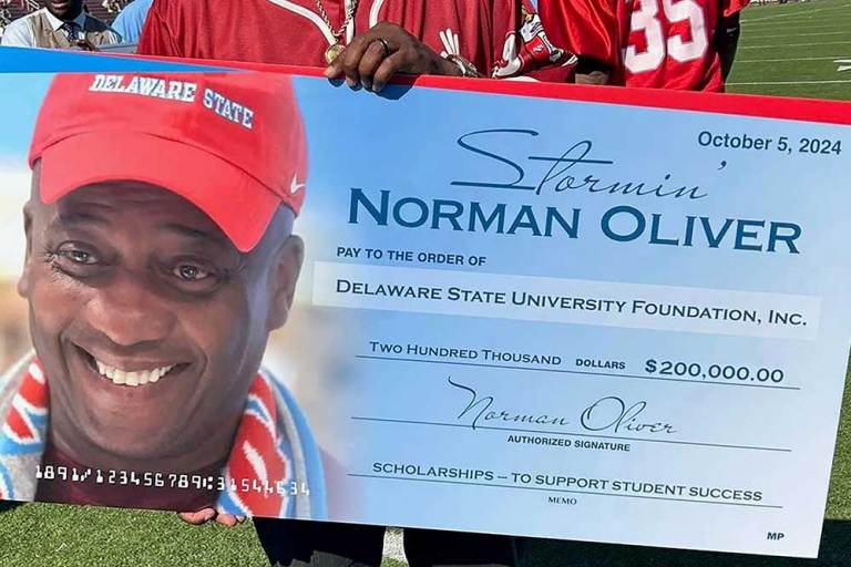 Norman Oliver donation check