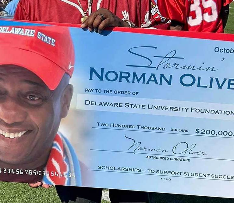 Norman Oliver donation check