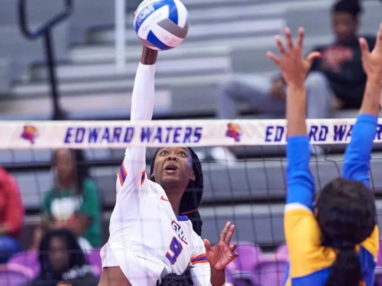 EWU women's volleyball player hits the ball in a game