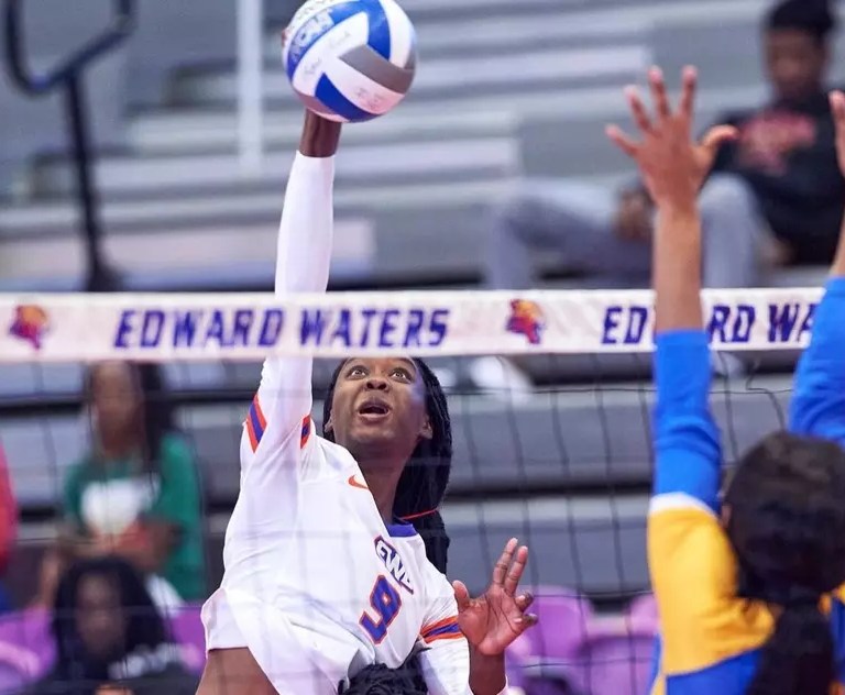 EWU women's volleyball player hits the ball in a game