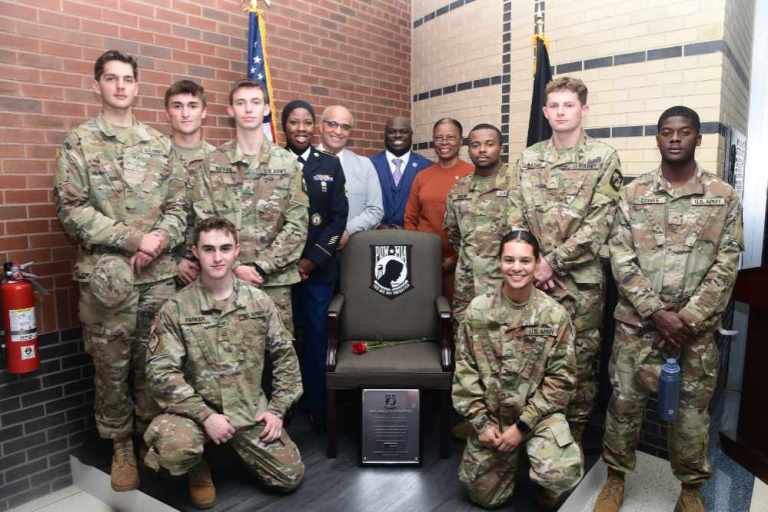 Members of the DSU U.S. Army ROTC pose at the POW-MIA “Chair of Honor” along with SFC Chareedra Othman, Andre Swegert, DSU President Tony Allen, and Col. (ret.) Debbie Harrington. The Chair of Honor has been permanently installed in the northwest corner on the first floor of the Claibourne D. Smith Administration Building.