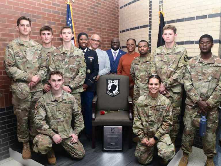 Members of the DSU U.S. Army ROTC pose at the POW-MIA “Chair of Honor” along with SFC Chareedra Othman, Andre Swegert, DSU President Tony Allen, and Col. (ret.) Debbie Harrington. The Chair of Honor has been permanently installed in the northwest corner on the first floor of the Claibourne D. Smith Administration Building.