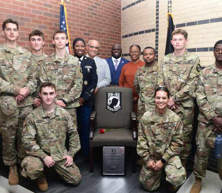 Members of the DSU U.S. Army ROTC pose at the POW-MIA “Chair of Honor” along with SFC Chareedra Othman, Andre Swegert, DSU President Tony Allen, and Col. (ret.) Debbie Harrington. The Chair of Honor has been permanently installed in the northwest corner on the first floor of the Claibourne D. Smith Administration Building.