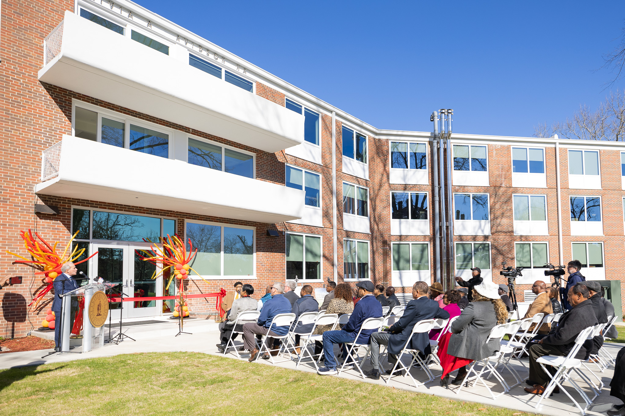 Ribbon cutting at the reopening ceremony of Olivia Davidson Hall.
