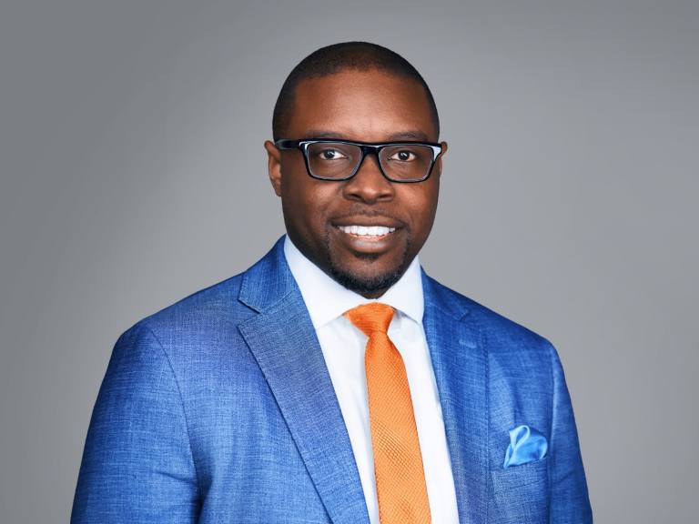 Dr Jermaine Whirl Orange Tie Headshot April 2025